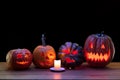 Halloween pumpkin head jack lantern with scary evil faces and candles