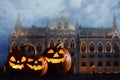 Halloween pumpkin head jack lanterns in front of ancient spooky castle