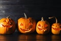 Halloween pumpkin head jack lanterns on table Royalty Free Stock Photo