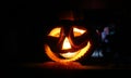 Halloween pumpkin jack o lantern with a spooky face on black background Royalty Free Stock Photo