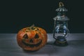 Halloween pumpkin and lamp. Happy Halloween holiday background with old vintage lamp