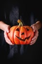 Halloween Pumpkin lantern in child's hands