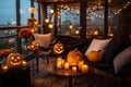 Halloween pumpkin lanterns with candles on the table in a cozy living room. Terrace decorated for Halloween.