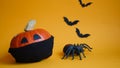 Halloween pumpkin in medical mask,spider and bats on orange background.concept championed Halloween holiday during Covid19 Royalty Free Stock Photo