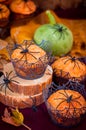 Halloween Pumpkin Muffins Decorated with Spiders and Spider Web Royalty Free Stock Photo