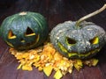 Halloween is the pumpkin. Halloween pumpkins decorated with pumpkin seeds placed on a wooden table.