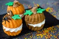 Halloween pumpkin recipe - funny cupcakes shaped pumpkin with cr Royalty Free Stock Photo