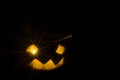 Halloween pumpkin smile and scary eyes for a party, Jack Lantern isolated on black background