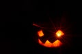 Halloween pumpkin smile and scary eyes for a party, Jack Lantern isolated on black background