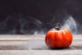 Halloween pumpkin with smoke and light in the dark night Royalty Free Stock Photo