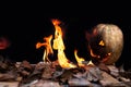 Halloween pumpkin spewing flames of fire on a black background Royalty Free Stock Photo