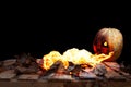 Halloween pumpkin spewing flames of fire on a black background Royalty Free Stock Photo