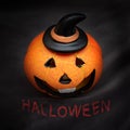 Halloween pumpkin with spooky smiling face on dark black background