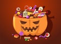 Halloween pumpkin with sweets. Cartoon cute scary basket full of child trick or treat candies for October festival Royalty Free Stock Photo