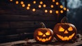 halloween pumpkin two carved pumpkins with glowing lights in the background Royalty Free Stock Photo