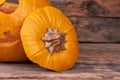 Halloween pumpkin on vintage wooden background.