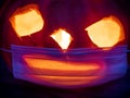 A halloween pumpkin wearing an anti covid surgical mask
