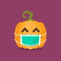 Halloween pumpkin wearing medical mask