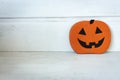 Halloween pumpkin on white background with copy space. Halloween decoration. Traditional October still life. Scary pumpkin.