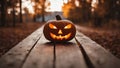 halloween pumpkin on a wooden table a carved pumpkin sitting on a wooden bench