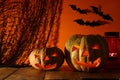 Halloween Pumpkin on wooden table in front of spooky dark background. Jack o lantern Royalty Free Stock Photo