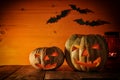 Halloween Pumpkin on wooden table in front of spooky dark background. Jack o lantern Royalty Free Stock Photo