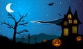 Halloween. Pumpkins on the background of old house, tree, crosses and mountains.