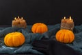 Halloween. Pumpkins, candles and black glove