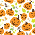 Halloween pumpkins with carved faces seamless pattern on white background with green autumn leaves Royalty Free Stock Photo
