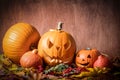 Halloween pumpkins, carved jack-o-lantern in fall leaves