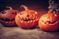 Halloween pumpkins family on rustic background
