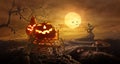 Halloween pumpkins on farm wagon going through Stretched road gr Royalty Free Stock Photo