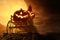 Halloween pumpkins on farm wagon at spooky in night of full moon