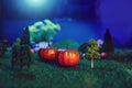 Halloween Pumpkins in the forest in the moonlight Halloween background. Fairy tale. Macro. Artificial magic dreamy world