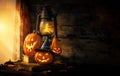 Halloween pumpkins and lantern in an old house by the window where the moonlight shines Royalty Free Stock Photo