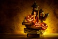 Halloween pumpkins of night spooky and Castle on wooden Royalty Free Stock Photo