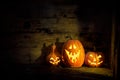 Halloween pumpkins in an old house by the window where the moonlight shines Royalty Free Stock Photo