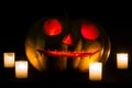 Halloween pumpkins with scary face and burning candle Royalty Free Stock Photo