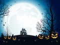 Halloween pumpkins, spooky trees and haunted house with moonlight on blue background.