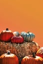 halloween pumpkins stacked on haystack