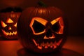 Halloween pumpkins under the moonlight, carved jack o lantern in the dark, generative ai Royalty Free Stock Photo