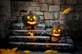 Halloween pumpkins in the yard of an old house at night Royalty Free Stock Photo