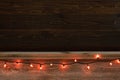 Halloween Rustic Wood Board Shelf and Backdrop with Orange Festive Strand of Lights. Room or space for copy, text or your words o