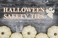 Halloween safety tips message with white pumpkins