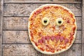 Halloween scary food funny monster face pizza horror snack with mozzarella