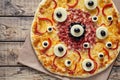 Halloween scary food monster pizza with eyes Royalty Free Stock Photo