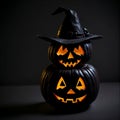 Halloween with a scary jack o lantern wearing a witch hat, isolated on black, spooky Royalty Free Stock Photo