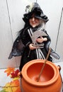 A Halloween Scary witch with empty cauldron to make witches brew