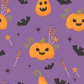 Halloween Seamless pattern with bats, pumpkin jack o lantern and candies on purple background. Vector illustration for Royalty Free Stock Photo