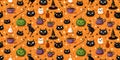 Halloween seamless pattern with black cats, witch hat, pumpkins and cup of tea. Vector illustration Royalty Free Stock Photo